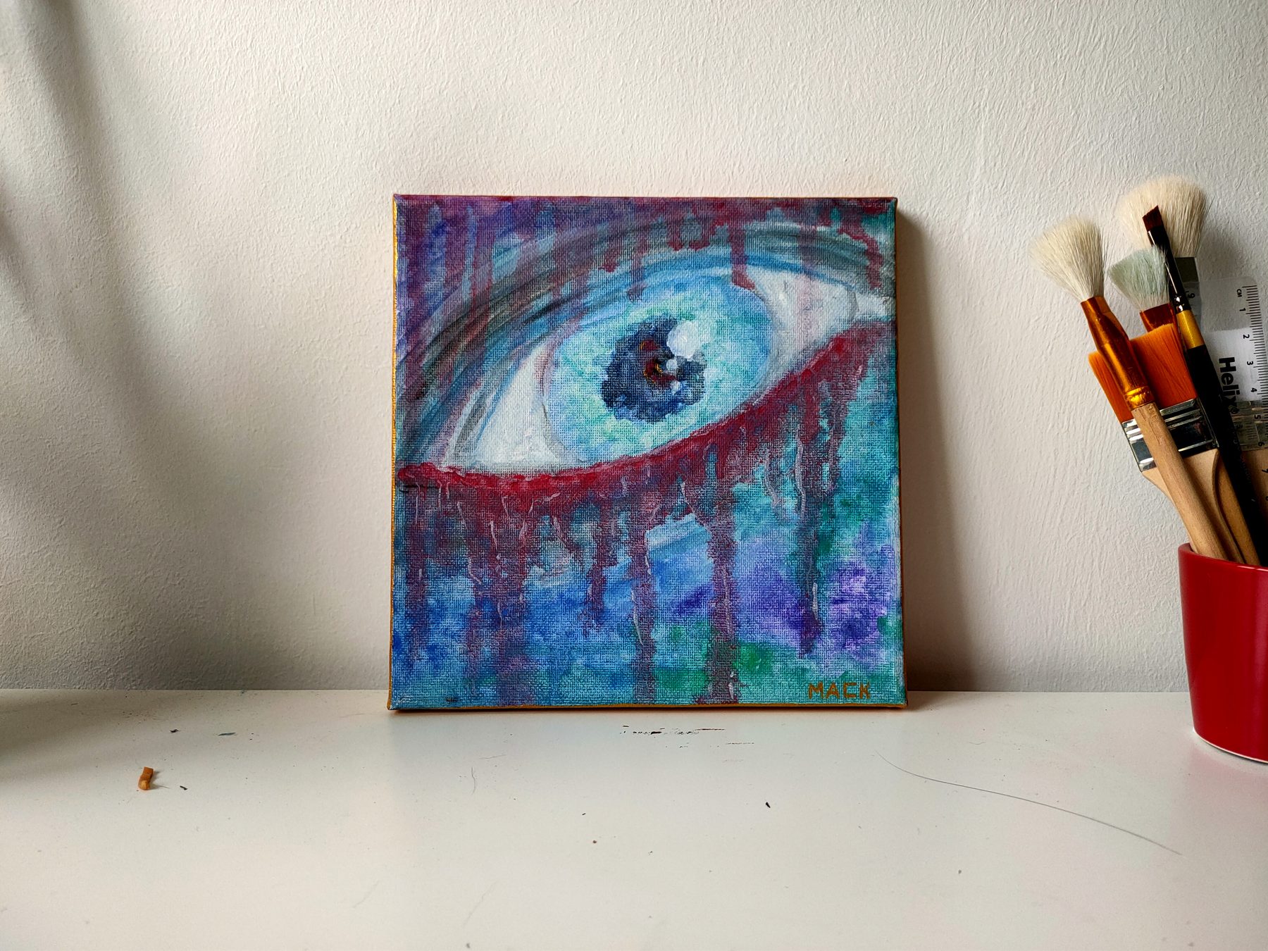 A single large eye in blue and purple, weeping red streaks down the canvas.