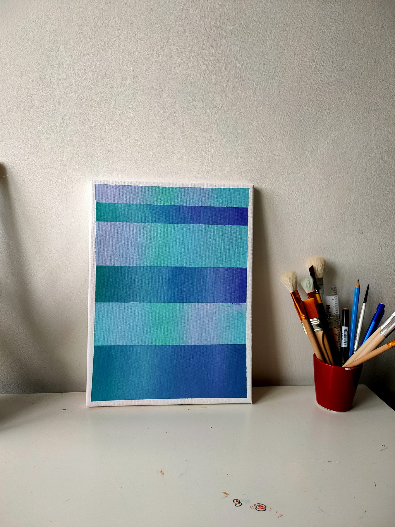 Horizontal bands shifting from green through to blue.