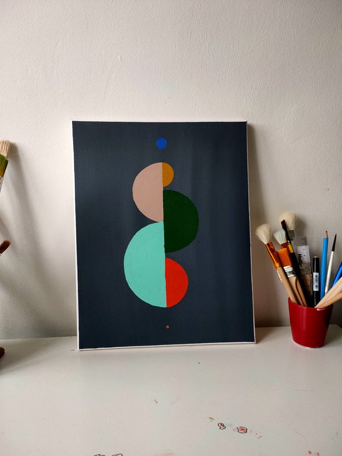 Circles and arcs in peach, green and teal stacked on a navy ground.